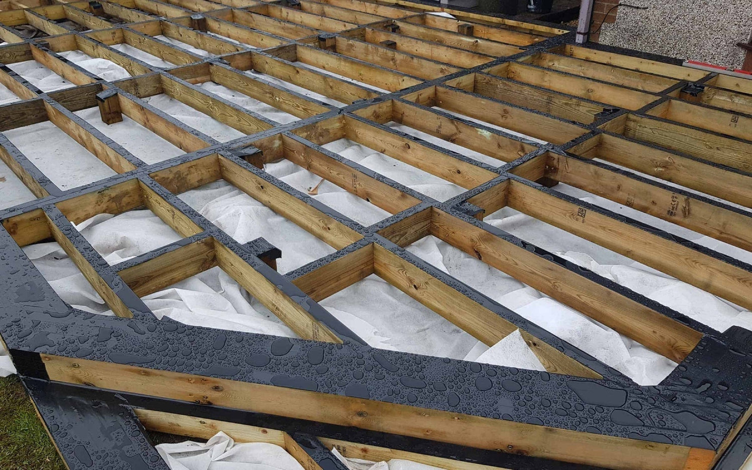 Timber subframe with a layer of decking tape.