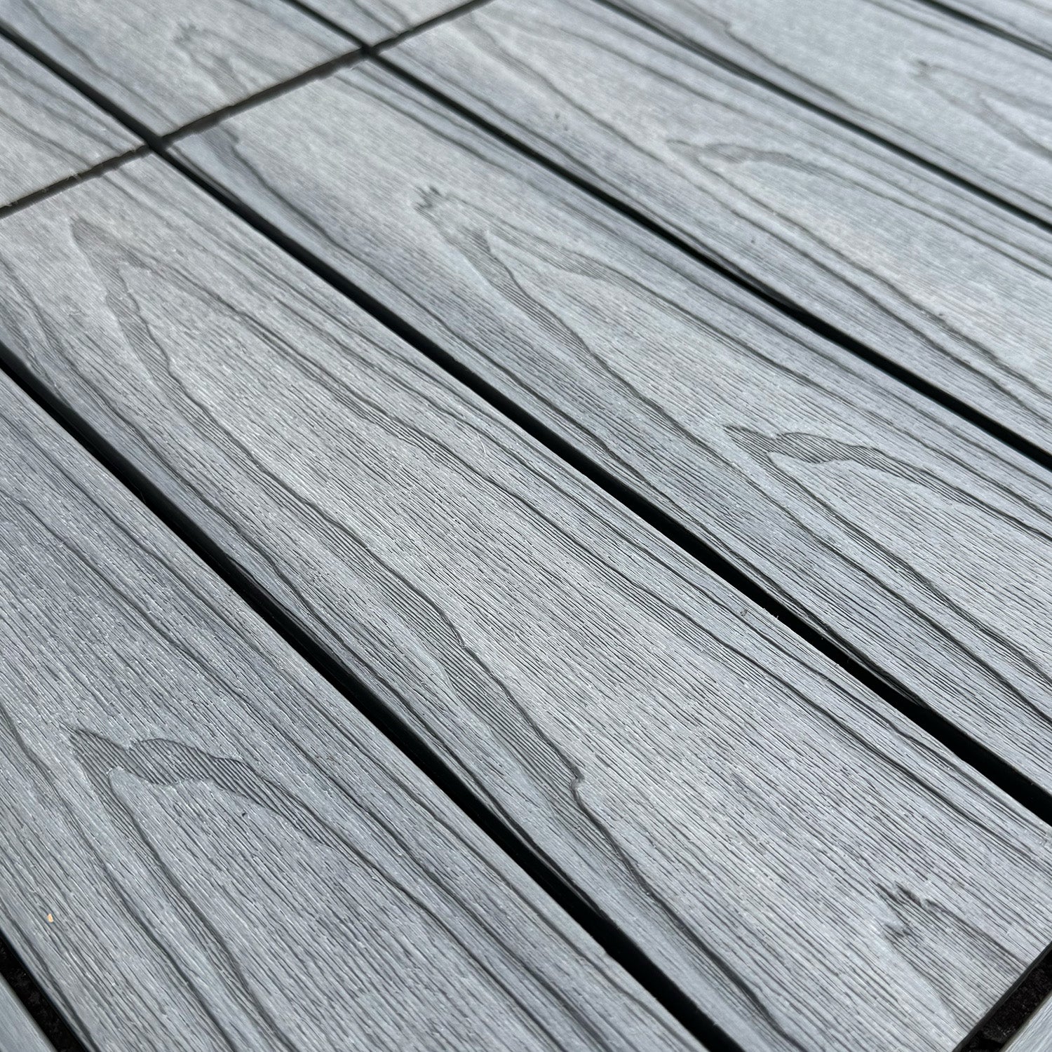 Deluxe composite deck tiles - capped composite materials
