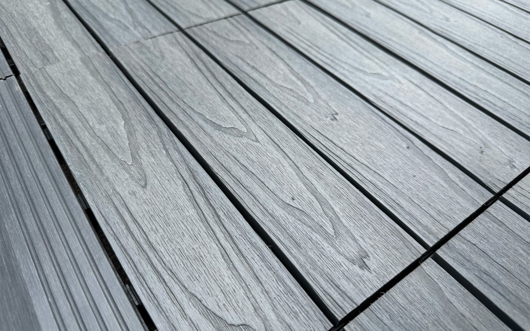 NeoTimber decking using composite deck tiles.