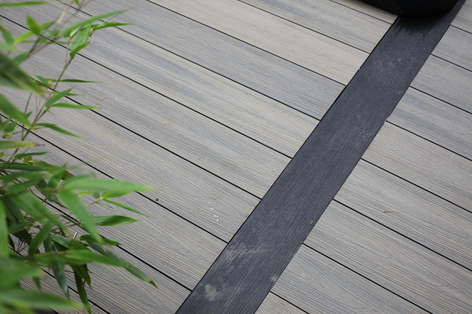 NeoTimber grey and charcoal composite deck boards.  