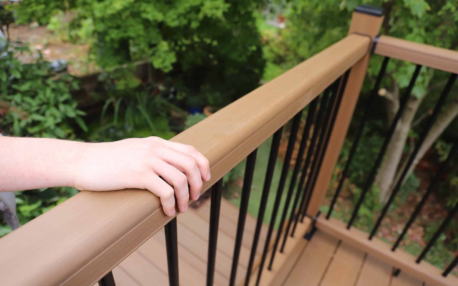 NeoTimber composite balustrade handrail offering a supporting hand. 