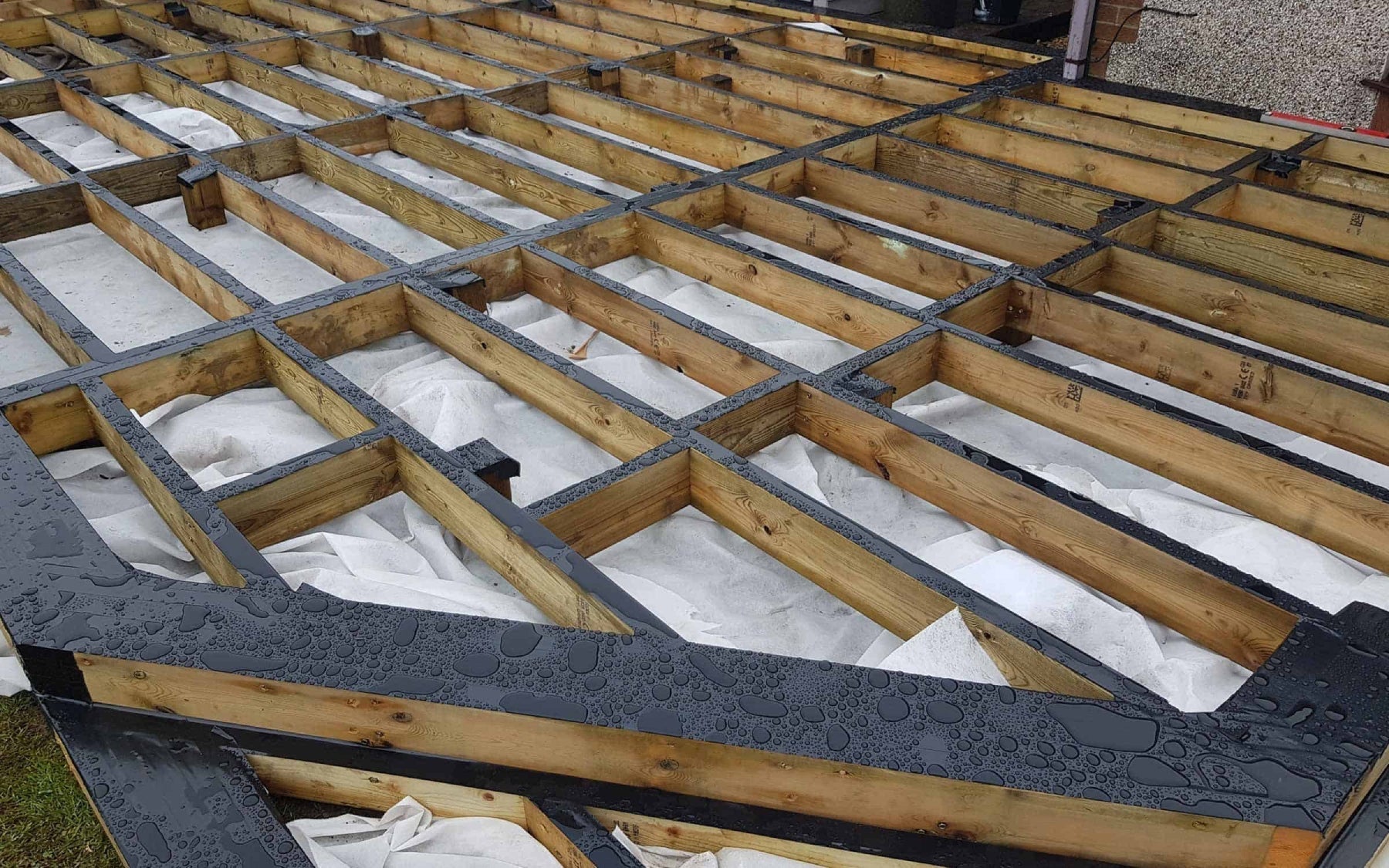 Timber subframe with a layer of decking tape.