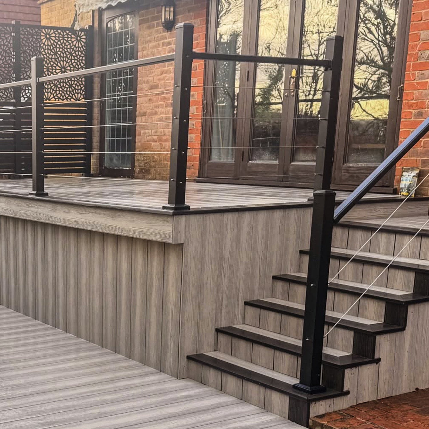 composite deck with aluminium balustrade stairs leading to a house