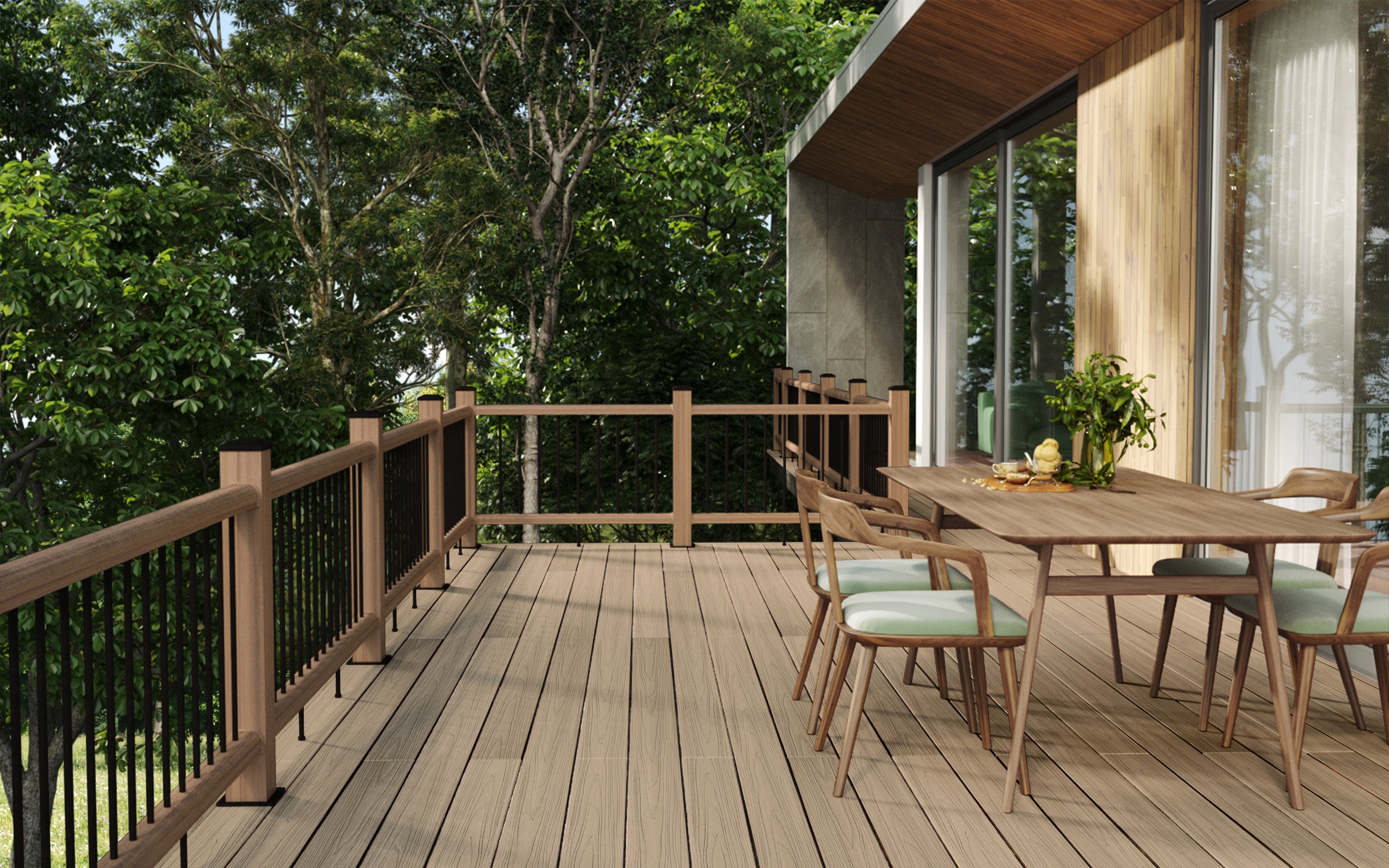 Spacious composite decking area with coordinating balustrades, creating a stylish outdoor dining space alongside a modern home.
