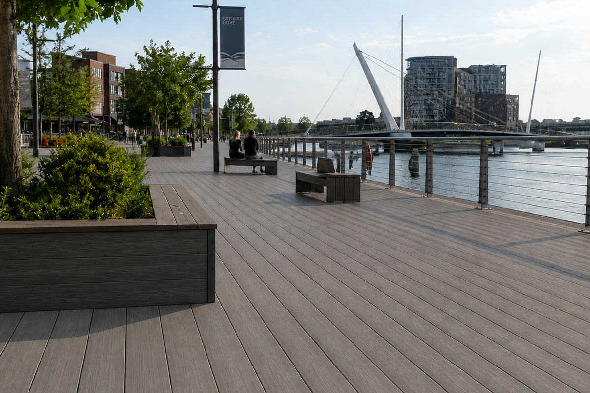 Modern public space with a composite deck featuring planters and balustrades