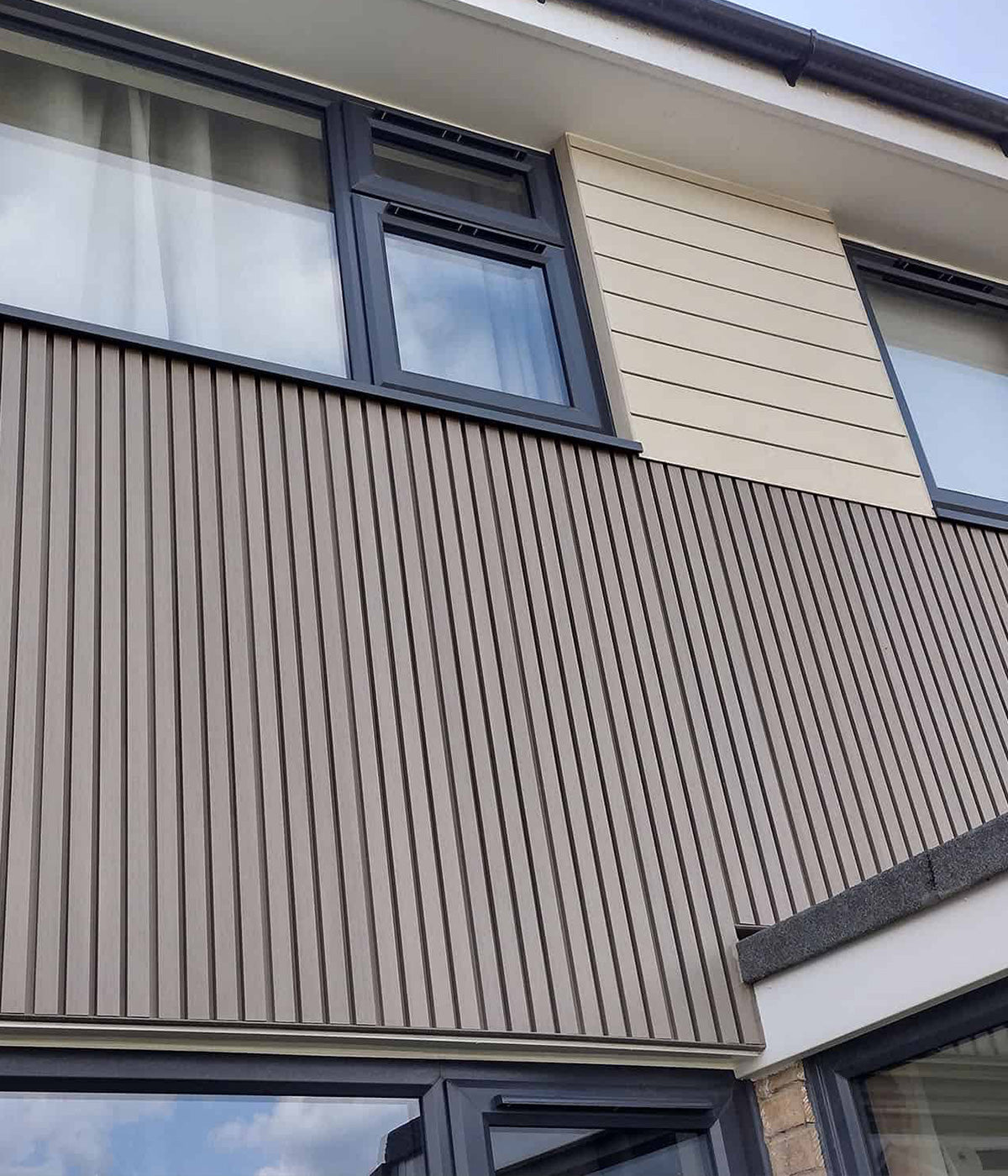 slatted composite cladding installed vertically